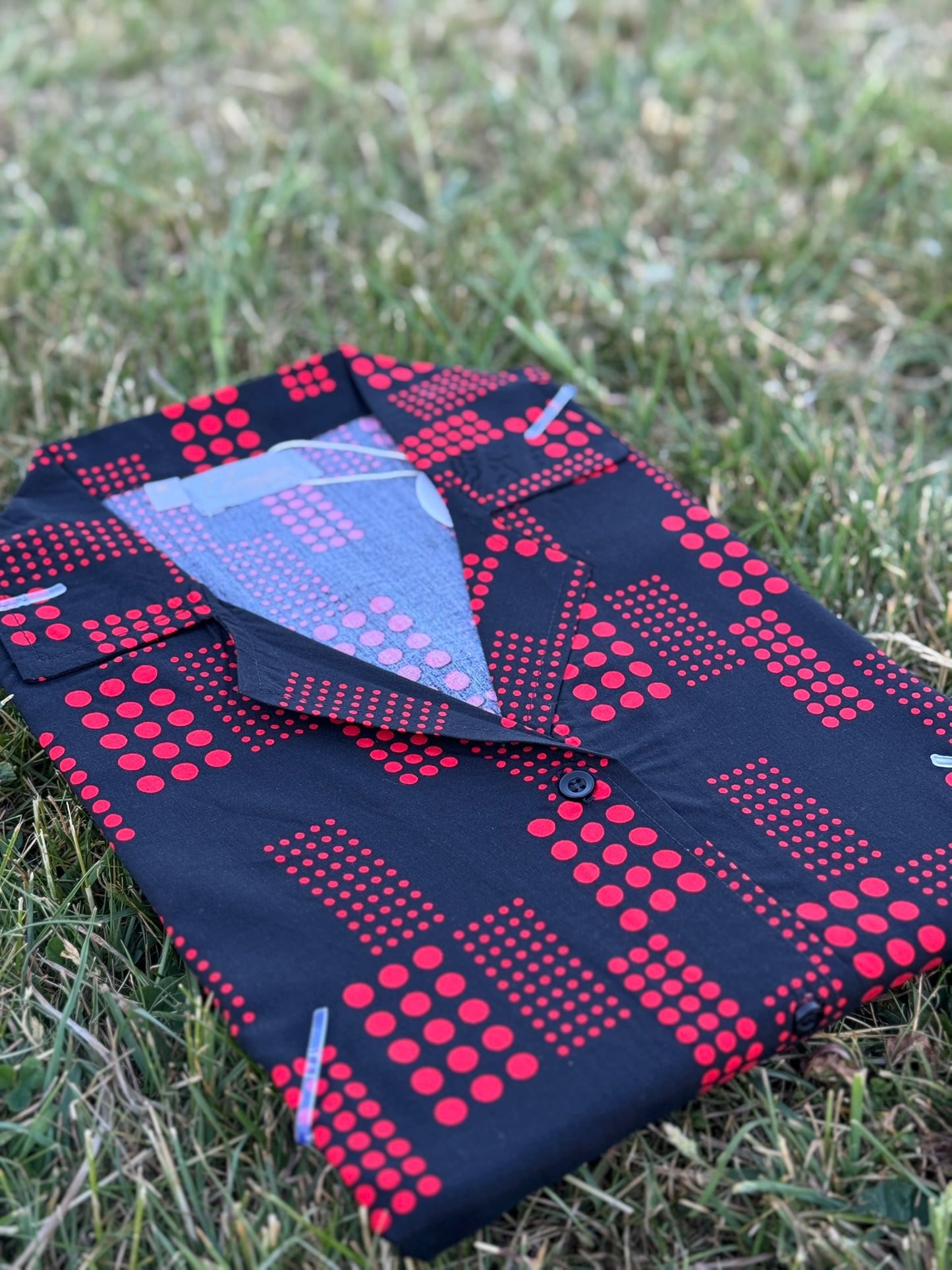 Iconico Metro button-up dress in Ruby Noir with red geometric pattern