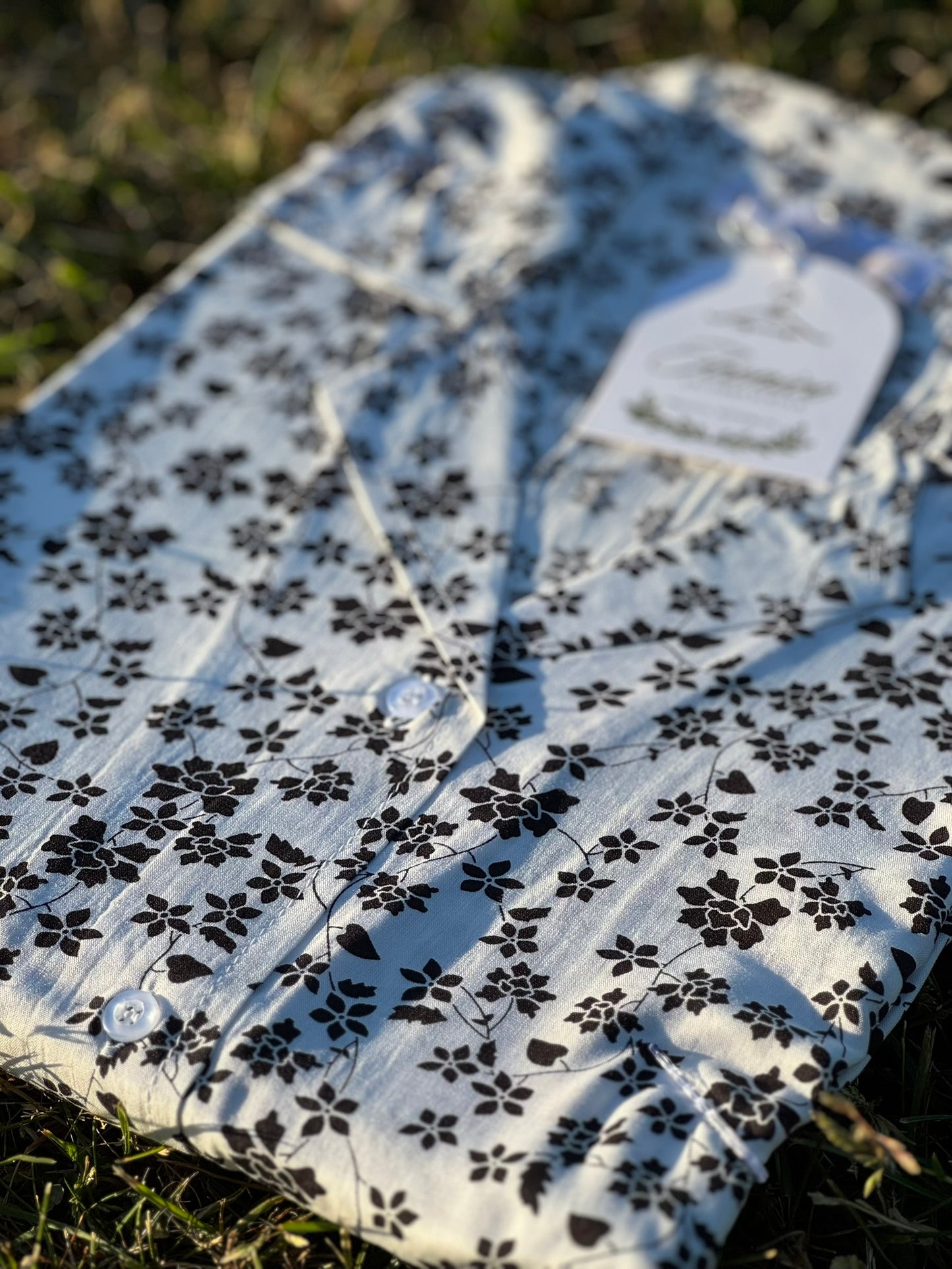 Serene Thread’s ivory noir linen shirt dress featuring delicate black flowers – Iconico Blossom