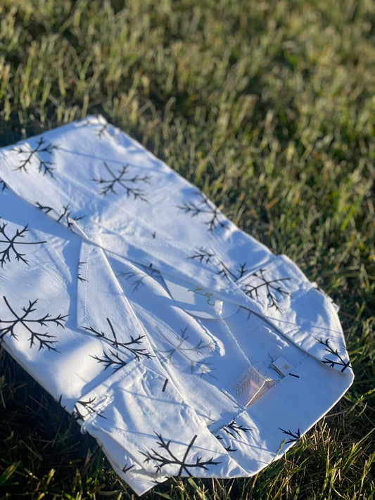 Iconico Frost button-up dress with black snowflake print on winter white linen