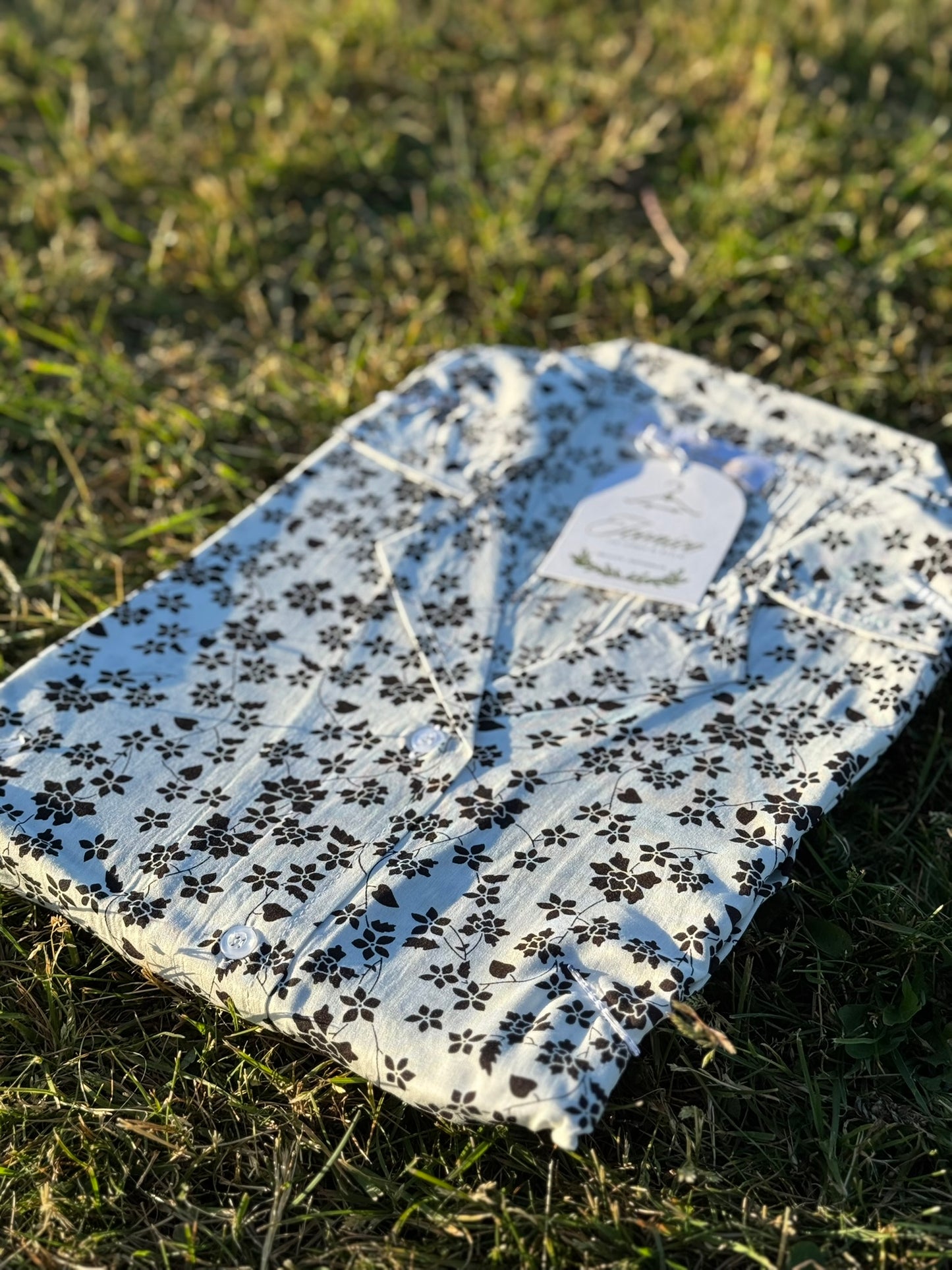 Elegant white linen dress with bold black floral design – Iconico Blossom by Serene Thread